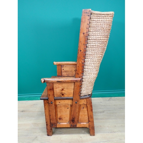 763 - A late 19th or early 20th Century pine Orkney Chair with traditional woven back, scroll ends to arm ... 