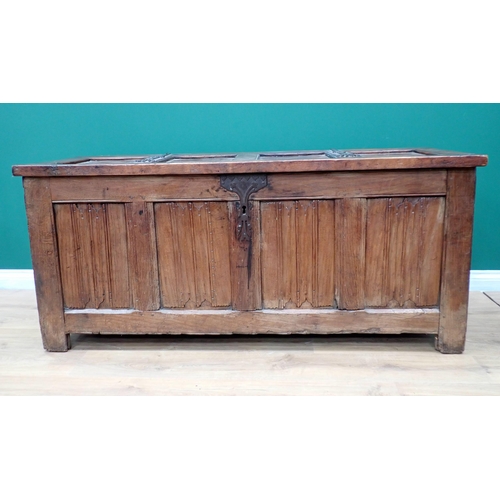 765 - A Norman or French joined oak Coffer utilising 16th Century and later elements, with strap hinged su... 