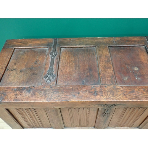 765 - A Norman or French joined oak Coffer utilising 16th Century and later elements, with strap hinged su... 