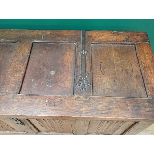 765 - A Norman or French joined oak Coffer utilising 16th Century and later elements, with strap hinged su... 