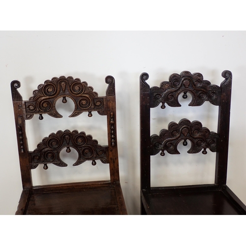 766 - Two 17th Century and later oak Derbyshire Chairs both with scroll carved double back rails, one show... 