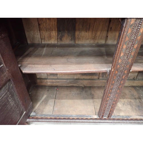 753 - A Charles I and later oak Court Cupboard, the upper section fitted pair of cupboard doors, the inlai... 