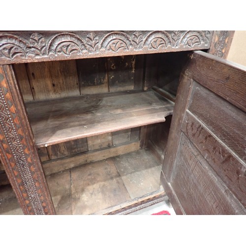 753 - A Charles I and later oak Court Cupboard, the upper section fitted pair of cupboard doors, the inlai... 