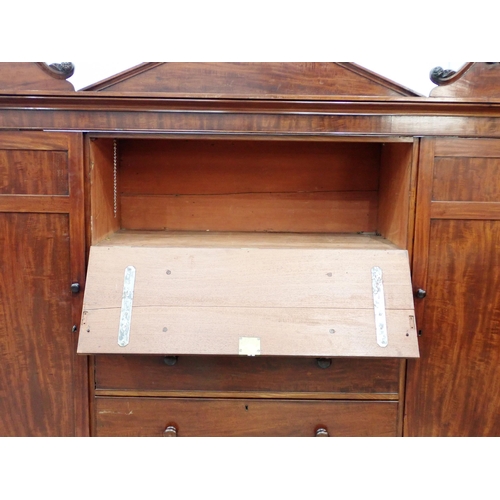 53 - A 19th Century mahogany Gentleman's Secretaire Cabinet having arched pediment, with a hinged pair of... 