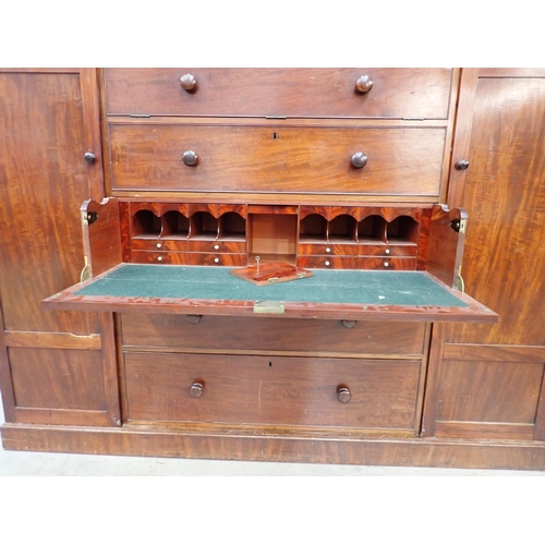 53 - A 19th Century mahogany Gentleman's Secretaire Cabinet having arched pediment, with a hinged pair of... 