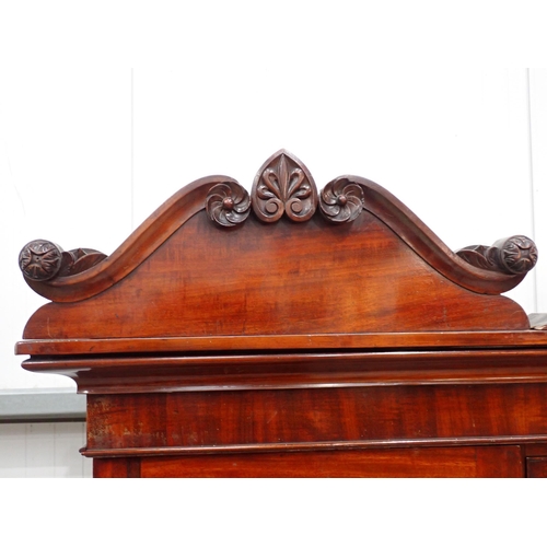 53 - A 19th Century mahogany Gentleman's Secretaire Cabinet having arched pediment, with a hinged pair of... 