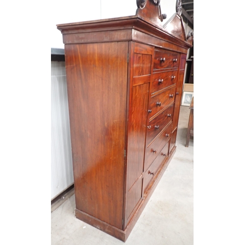 53 - A 19th Century mahogany Gentleman's Secretaire Cabinet having arched pediment, with a hinged pair of... 