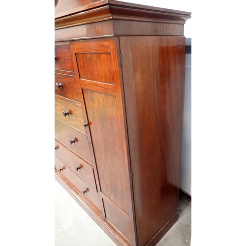 53 - A 19th Century mahogany Gentleman's Secretaire Cabinet having arched pediment, with a hinged pair of... 