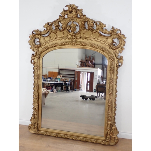 64 - A late 18th Century/early 19th Century Irish gilt Overmantel Mirror with elaborate pierced and scrol... 