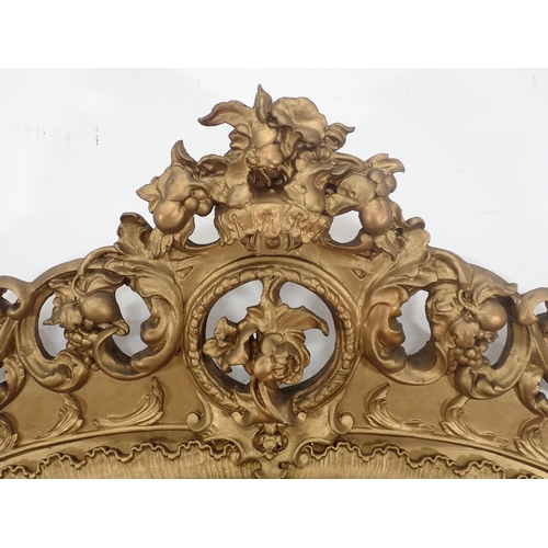 64 - A late 18th Century/early 19th Century Irish gilt Overmantel Mirror with elaborate pierced and scrol... 