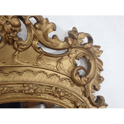 64 - A late 18th Century/early 19th Century Irish gilt Overmantel Mirror with elaborate pierced and scrol... 