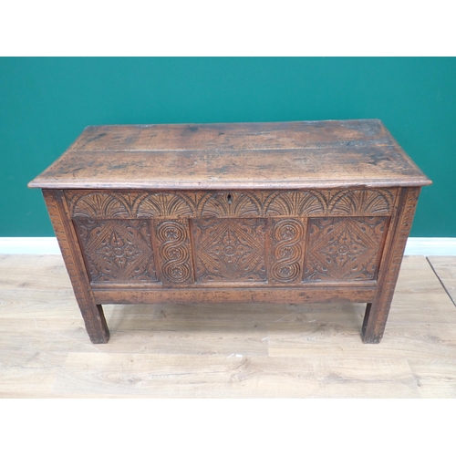 75 - A 17th Century oak Coffer with plank lid above arcaded frieze and three diamond and rosette panels, ... 