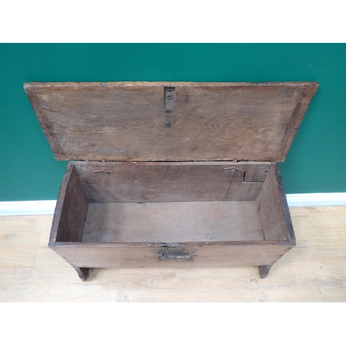 85 - A 17th Century oak plank Coffer with hinged top, moulded detail on shaped side supports, 3ft 1in (la... 