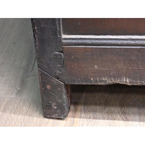 86 - A 17th Century oak Coffer with plank lid above three carved panels having floral inlay, 4ft 9in