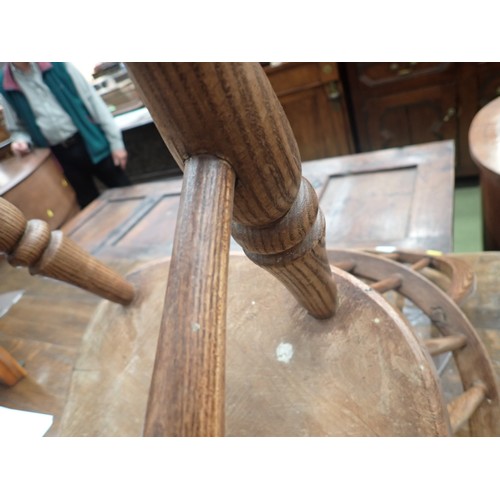 91 - A 19th Century ash and elm child's Windsor Elbow Chair with hoop back on turned supports and stretch... 