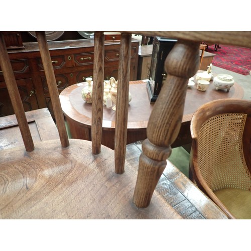 91 - A 19th Century ash and elm child's Windsor Elbow Chair with hoop back on turned supports and stretch... 