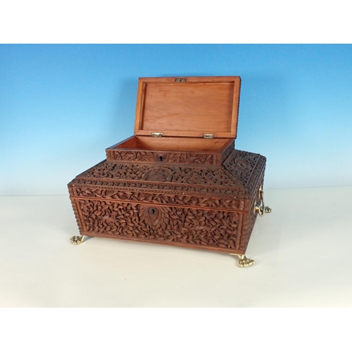 302 - A large carved sandalwood Jewellery Box with hinged upper cover carved with figures, the main hinged... 