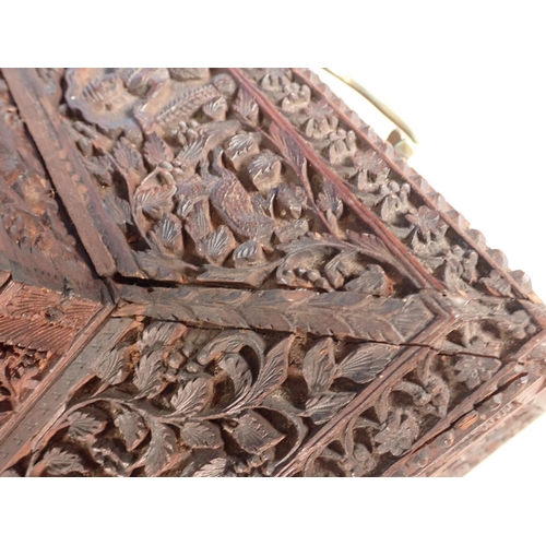 302 - A large carved sandalwood Jewellery Box with hinged upper cover carved with figures, the main hinged... 