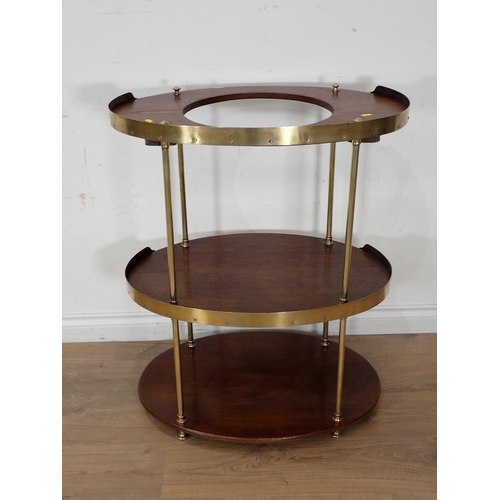 308 - A 19th Century oak or camphor oval Campaign Washstand with brass rim and supports, collapsible for t... 