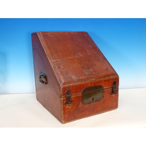 310 - A 19th Century tooled and embossed leather Knife Box with hinged sloping front enclosing a lined and... 