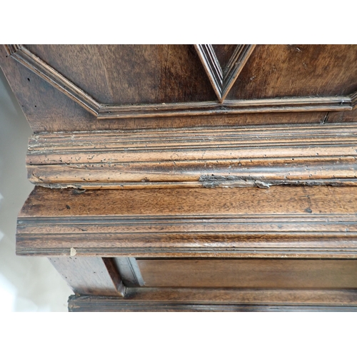 317 - An 18th Century Continental walnut Chest on stand fitted pair of panelled doors having octagonal pai... 