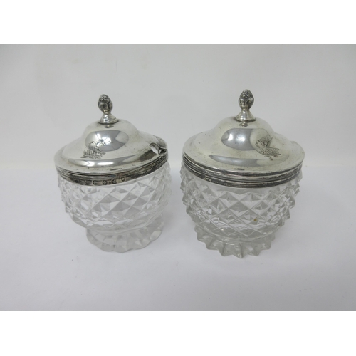 89 - A plated circular Cruet Stand with central handle fitted eight cut glass bottles and jars, two with ... 