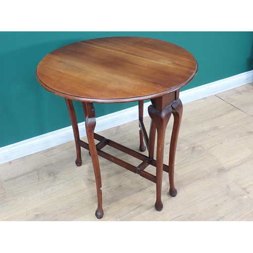 404 - A Georgian style mahogany oval Sutherland Table with moulded top mounted upon fine cabriole supports... 