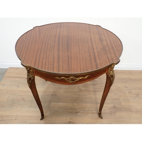 425 - A French mahogany Centre Table with a gilded metal edge and gilt mounts to the slender cabriole supp... 