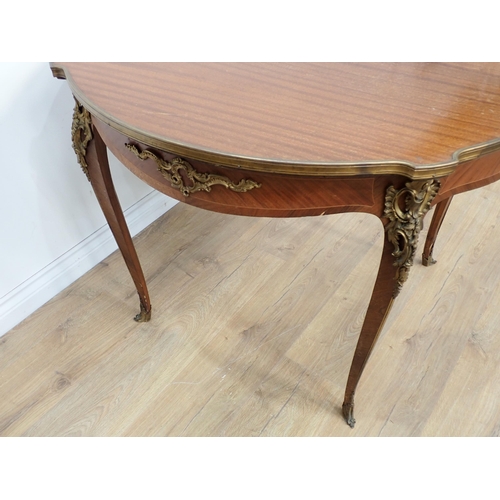 425 - A French mahogany Centre Table with a gilded metal edge and gilt mounts to the slender cabriole supp... 