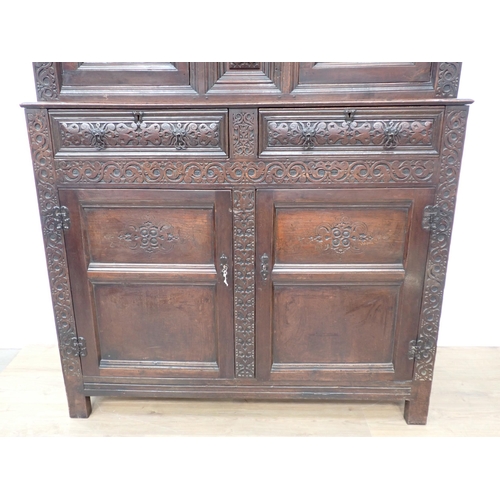 428 - An early 18th Century oak Court Cupboard initialled and dated 'RSA 1701' with leafage carved decorat... 