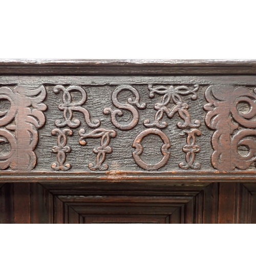 428 - An early 18th Century oak Court Cupboard initialled and dated 'RSA 1701' with leafage carved decorat... 