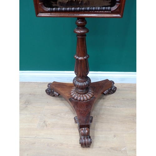 436 - A 19th Century rosewood Polescreen with floral needlework panel on turned tapering and carved column... 