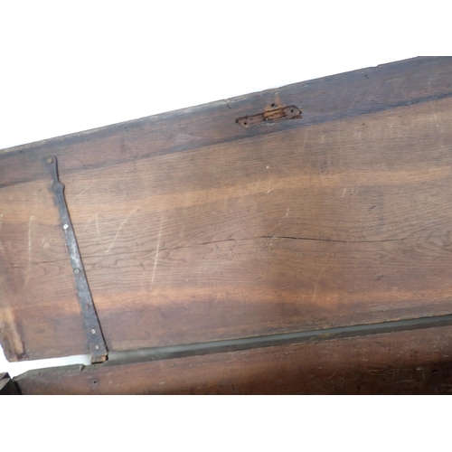 445 - A 17th Century and later oak plank Chest with plain moulded lid above profusely carved front with fo... 