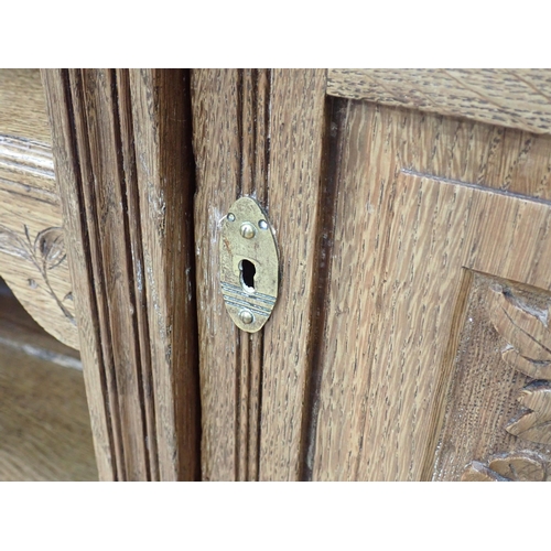 449 - A carved oak Sideboard fitted drawers and cupboards, 6ft W x 3ft 1in H