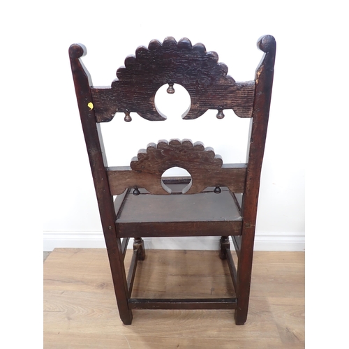 451 - Two 17th Century and later oak Derbyshire Chairs, one with inward scroll upright terminals and mount... 