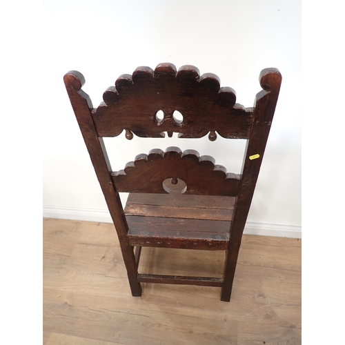 451 - Two 17th Century and later oak Derbyshire Chairs, one with inward scroll upright terminals and mount... 