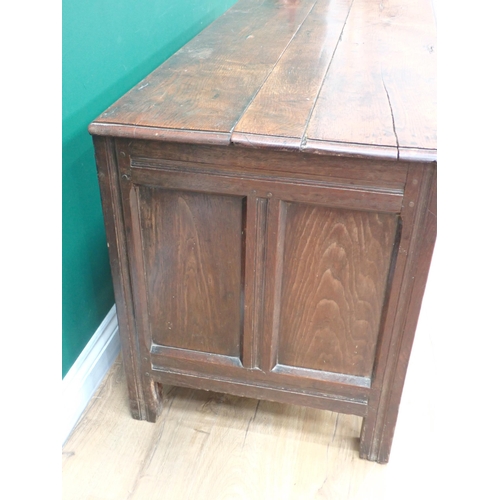 355 - An antique oak Coffer with plank lid above plain three panel front, 4ft 1in