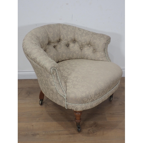 368 - A Victorian Tub Chair by Howard & Sons with button back upholstery mounted upon turned walnut front ... 