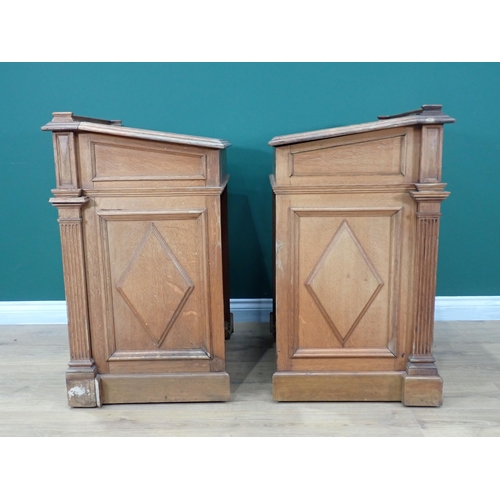 375 - A pair of Victorian panelled oak Desks, the hinged sloping top with inset writing surfaces decorated... 