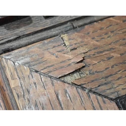 375 - A pair of Victorian panelled oak Desks, the hinged sloping top with inset writing surfaces decorated... 