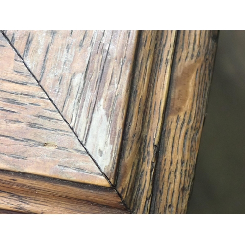 375 - A pair of Victorian panelled oak Desks, the hinged sloping top with inset writing surfaces decorated... 