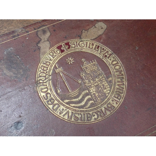 375 - A pair of Victorian panelled oak Desks, the hinged sloping top with inset writing surfaces decorated... 