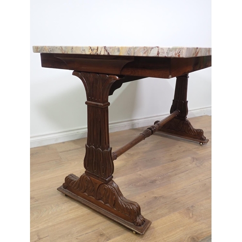 400 - A Regency Centre Table with veined marble top, the cheval frame support with carved decoration and c... 