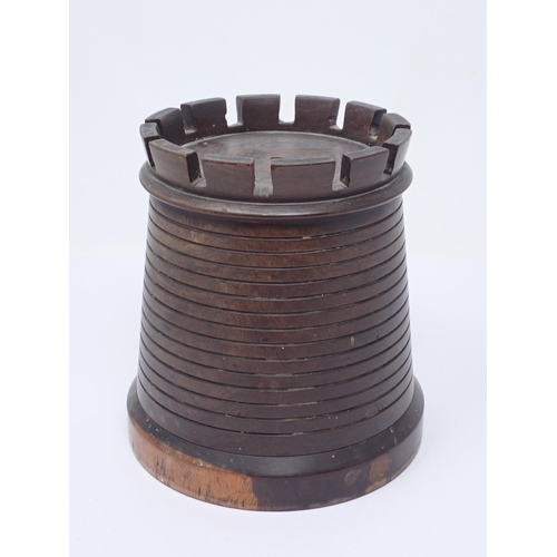 123 - A lignum vitae String Box in the form of a tapering cylindrical castellated tower, 5¼in H