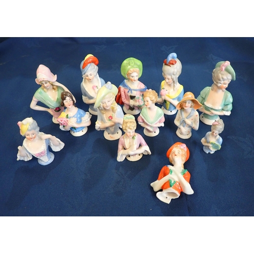 126 - A Collection of 13 Ceramic Pin Cushion Dolls some A/F.