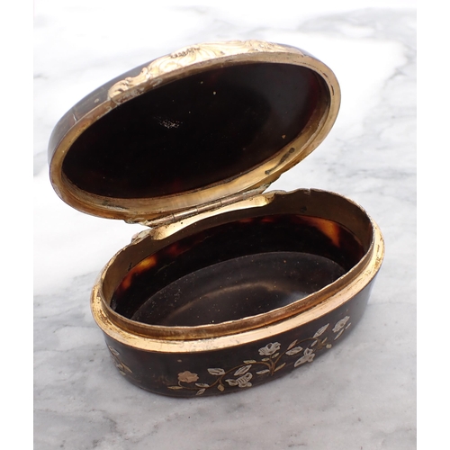 130 - A 19th Century oval tortoiseshell Snuff Box with silver and gold piqué decoration and yellow metal m... 