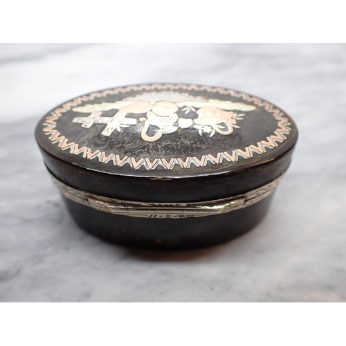 132 - A 19th Century oval tortoiseshell Snuff Box the hinged lid inlaid piqué vignette with white metal mo... 