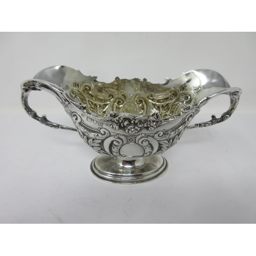 175 - A Victorian silver two-handled Sugar Bowl, floral and leafage decorated on oval pedestal base, Londo... 