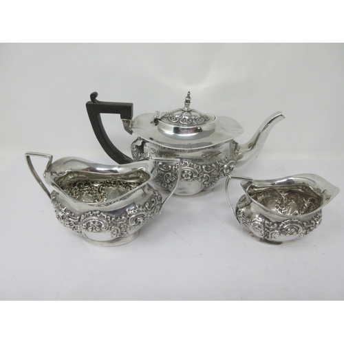 178 - An Edward VII silver three-piece Tea Service, floral and scroll embossed, Chester 1901, 480gms