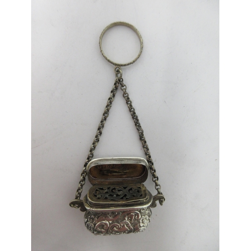 200 - A Victorian silver Vinaigrette of bombé form with floral and scroll decoration, scroll pierced grill... 